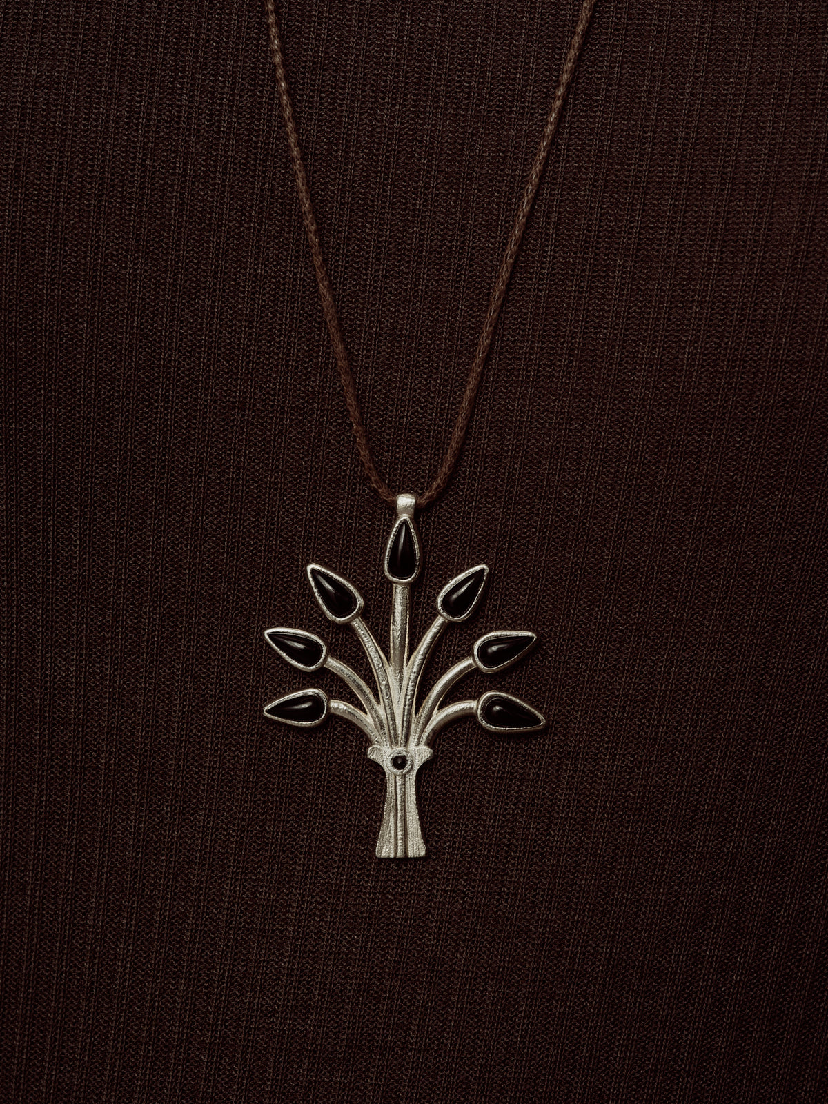 Silver-tone Sacred Tree pendant on long chain with openwork leaf design