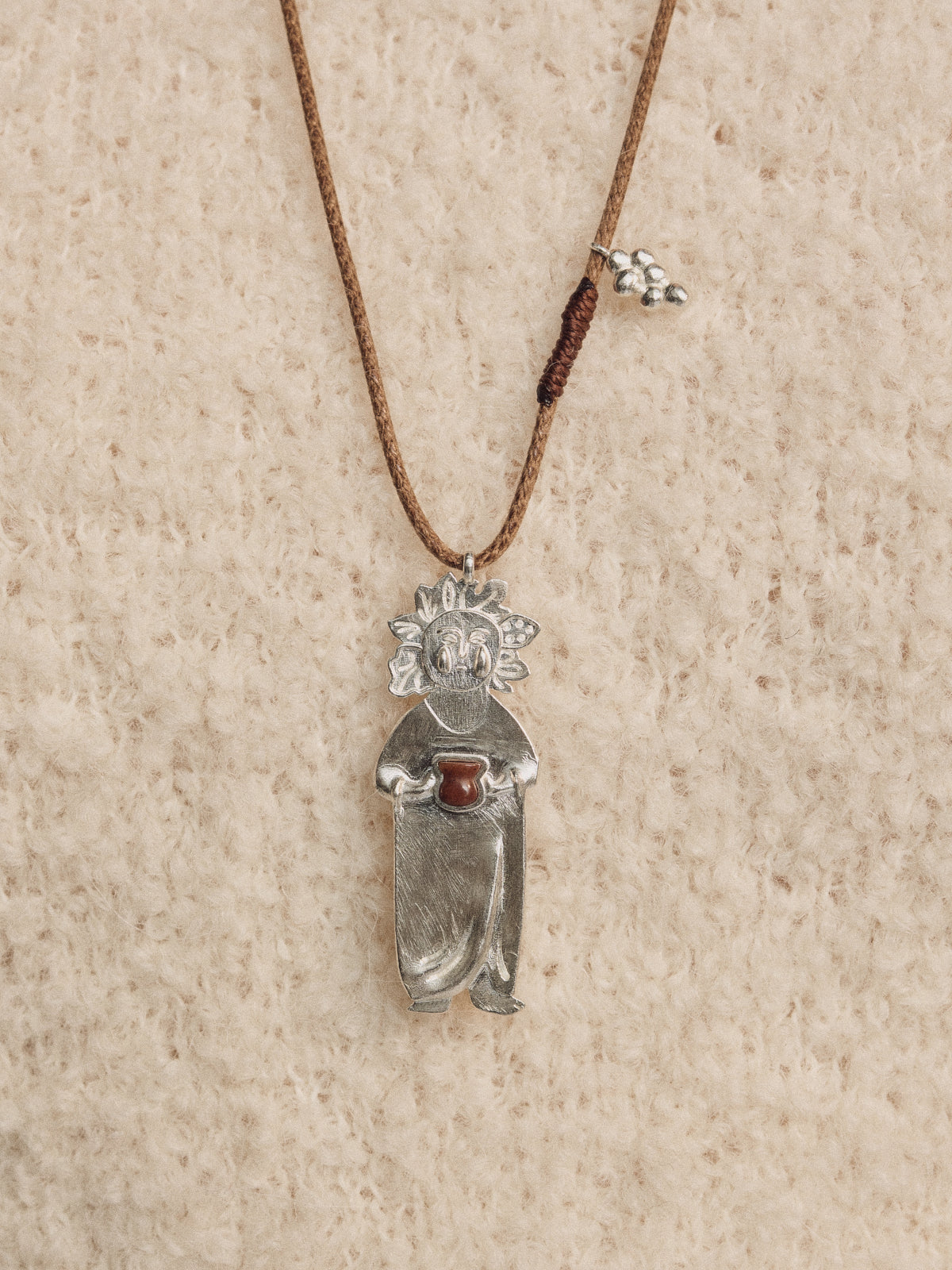 Silver wine-man figurine pendant on long cord necklace